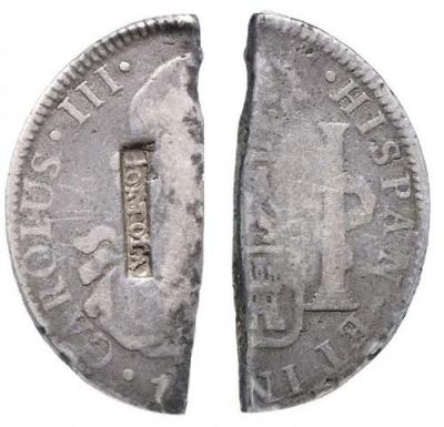 BRITISH VIRGIN ISLANDS TORTOLA - 4 Shilling, 1,5 Pence s.d. (1801) contromarcati con scritta TORTOLA su un 8 Reales messicano di Carlo IV, tagliato. Kr. 7 Ag.jpg